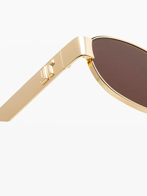 Détail de la branche dorée d’une paire de lunettes