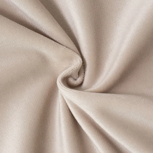 Gros plan sur un velours beige drapé